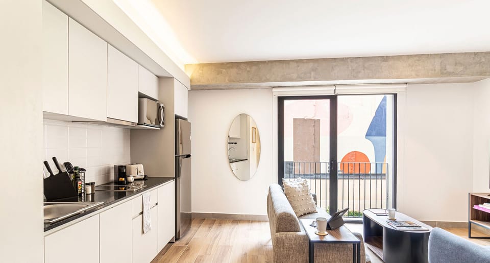 The building contains several similar units, Furniture, decor, and amenities may vary.