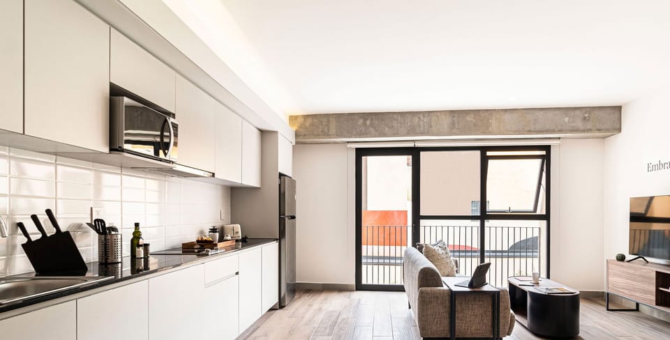 The building contains several similar units, Furniture, decor, and amenities may vary.