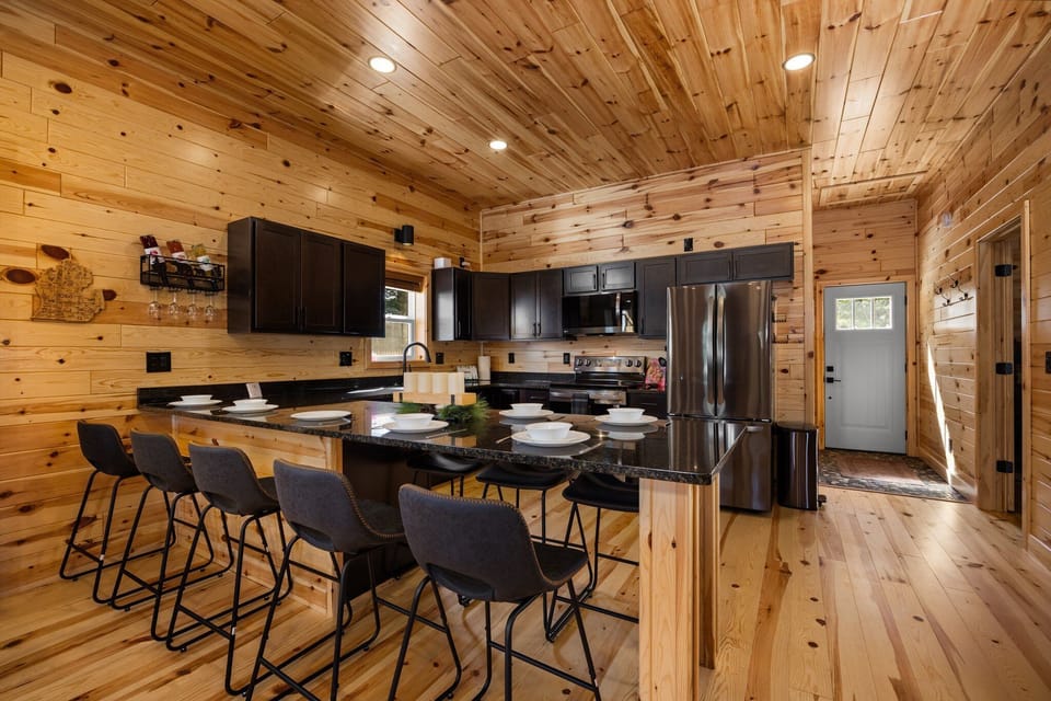 Gather for group meals at the large island in our modern cabin kitchen.