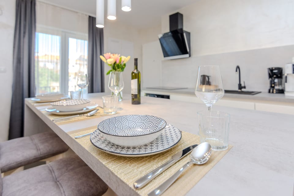 From the kitchen island, enjoy the view out to the spacious balcony 