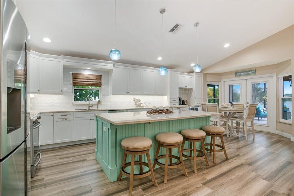 Enormous kitchen with all the essentials. And a coffee and bar station