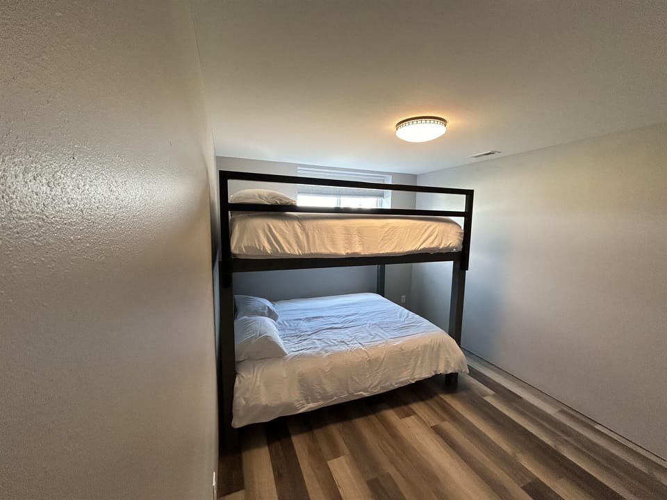 Basement bedroom with bunk beds.