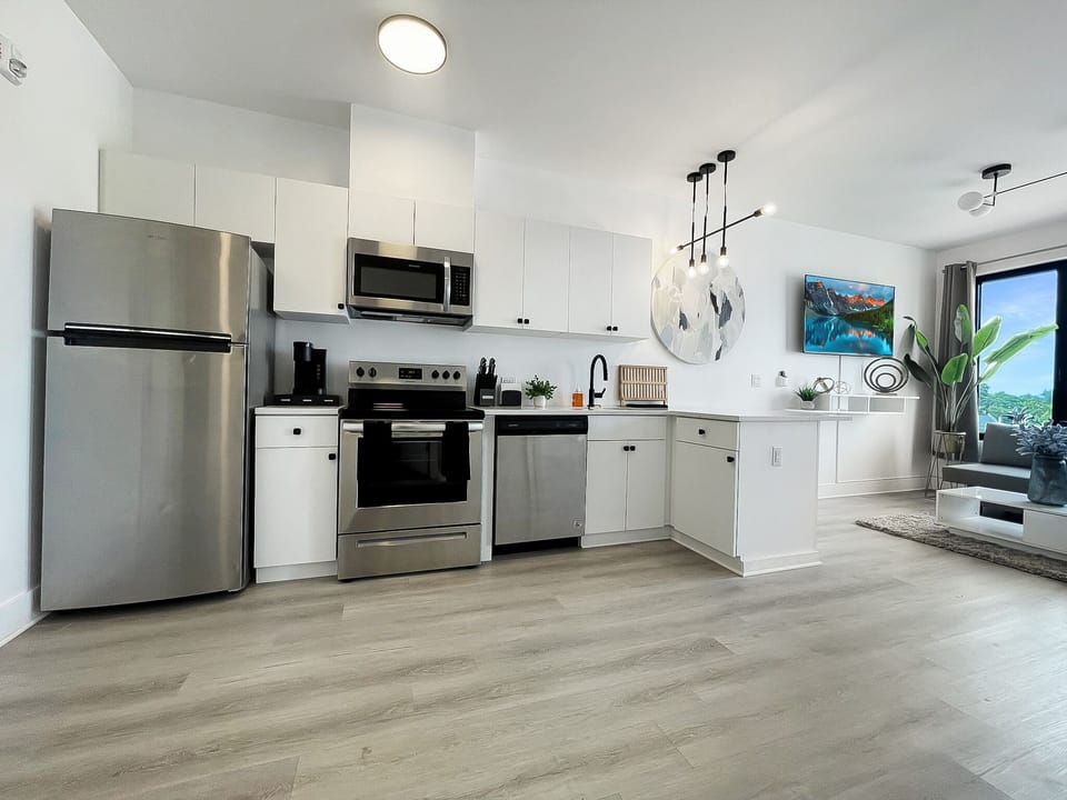 Open-concept kitchen
- utensils
- knife set
- Keurig coffee maker
- cutting mats
