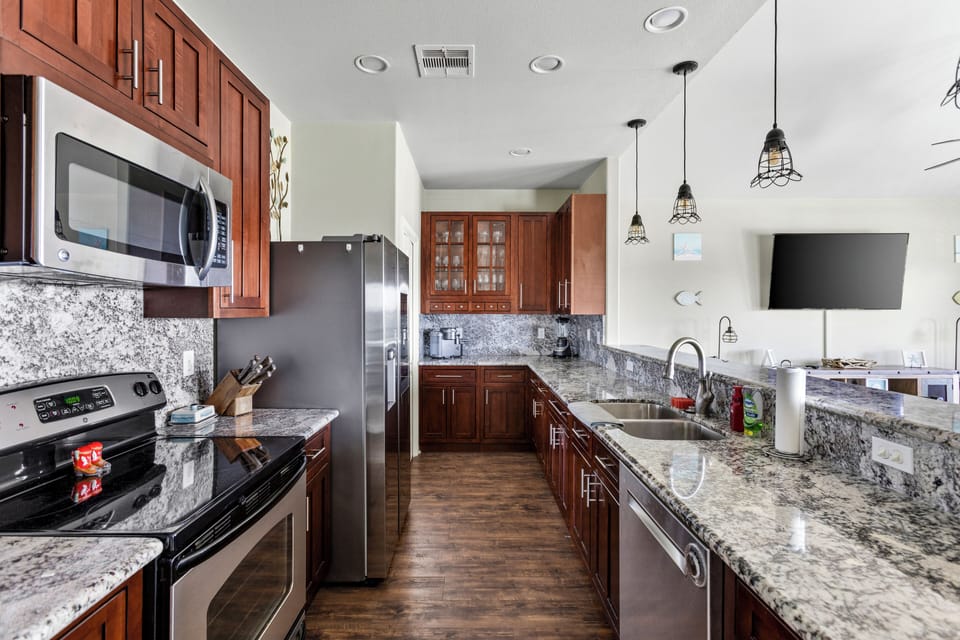 Fully equipped kitchen with stainless steal appliances and granite countertops. 