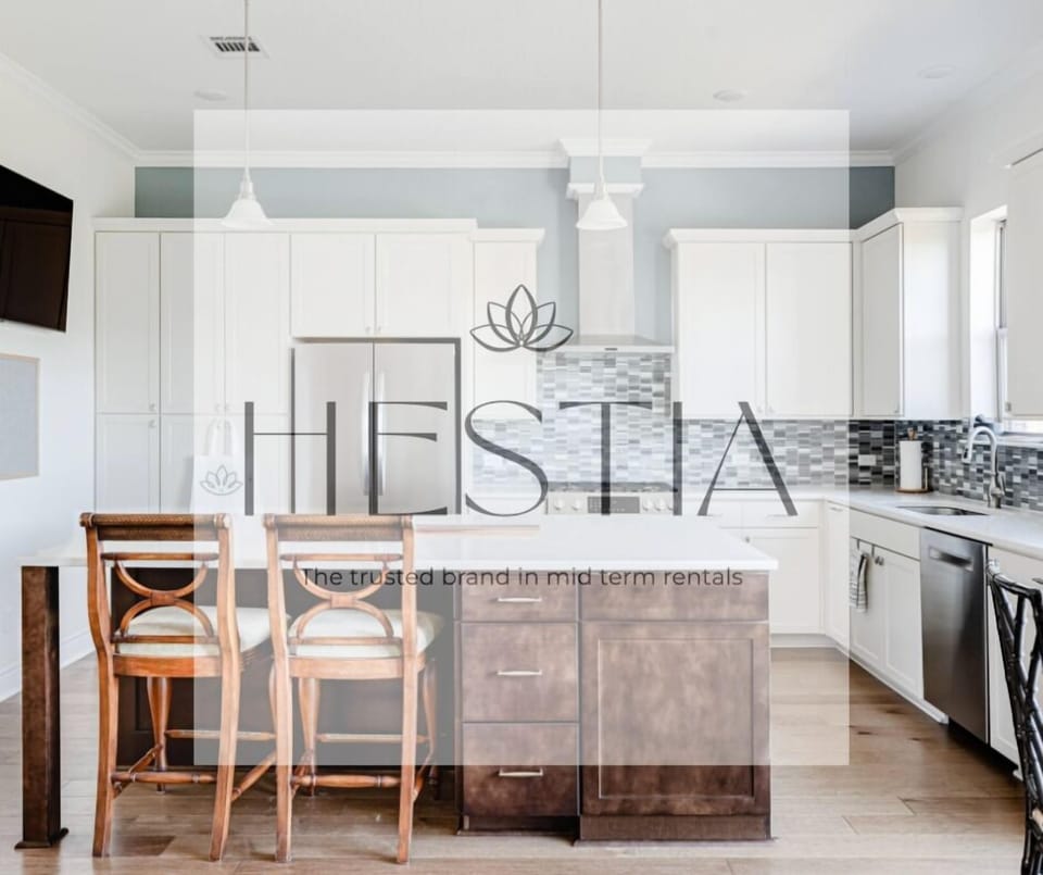 Gourmet kitchen with 5 burner gas stoves will delight any home chef.  Features a bar fridge to keep all your drinks cold.