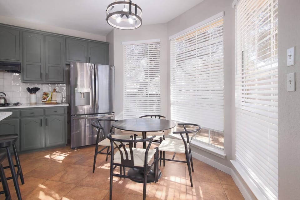 Enjoy a unique dining experience within the kitchen, where plenty of natural light streams in to create a cozy and inviting atmosphere. Perfect for shared meals and warm conversations.