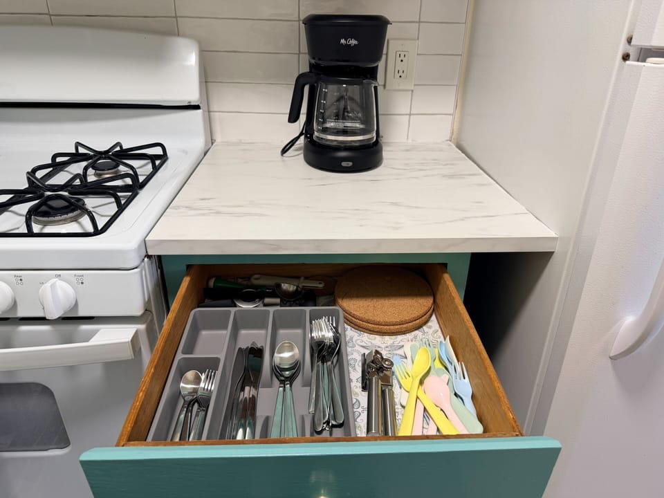 Enough silverware and plates for a long stay.