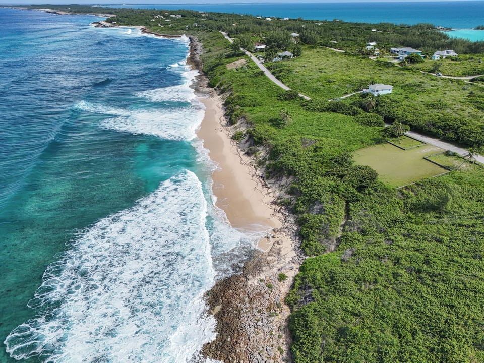 Soaring above the crystal-clear waters, this drone shot offers a stunning bird's