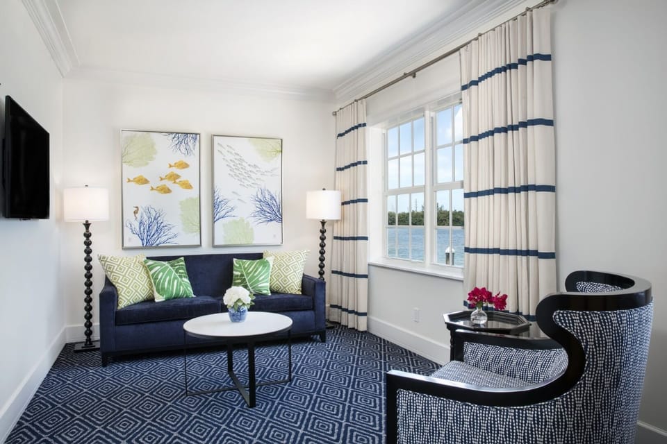 Unwind on the cozy sofa with calming waterfront views.