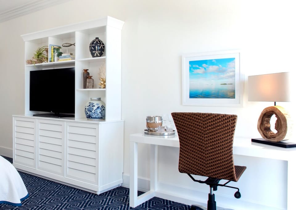 Settle in comfortably with TV, storage, and a work nook.