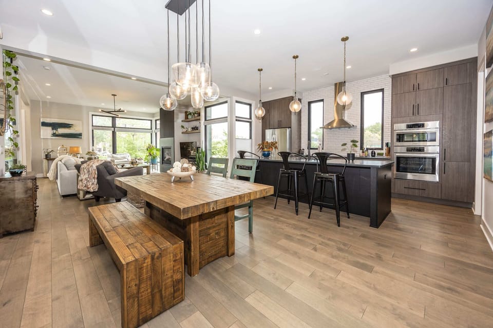 A full view of the kitchen, dining area, and living space, all seamlessly connected for effortless entertaining and relaxation.