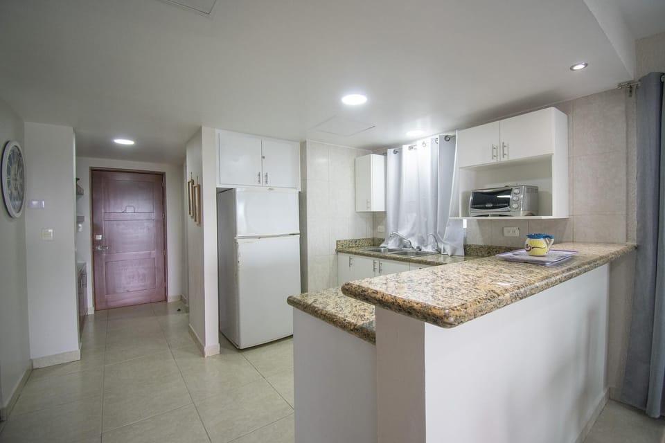 Bright, modern kitchen with granite countertops and stainless appliances