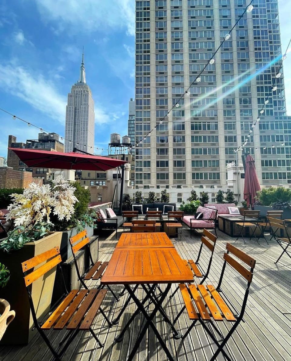 Sip and socialize in the sun with skyline all around.