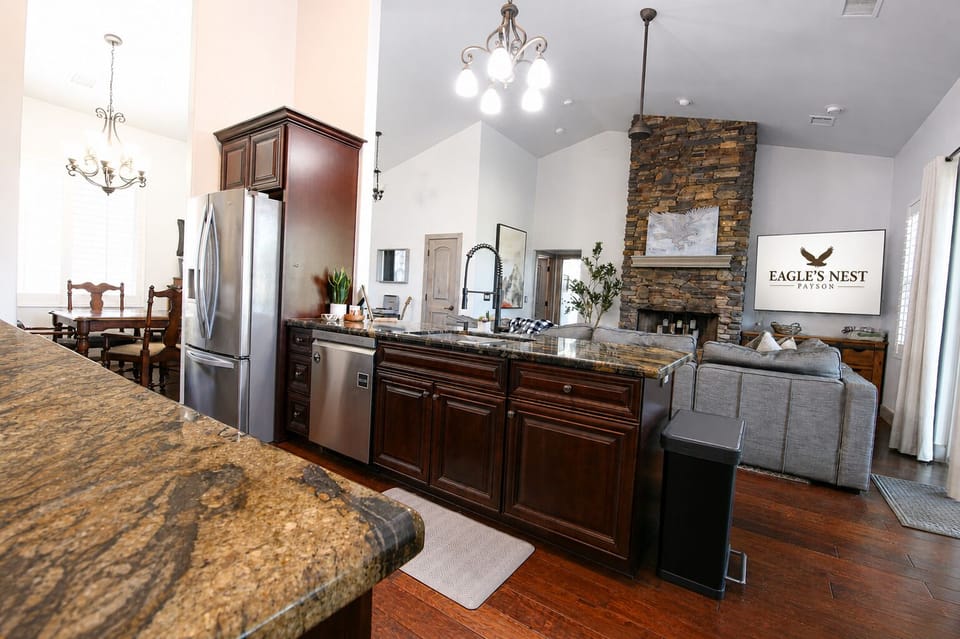 Entertain and unwind with ease in this open living space featuring a spacious kitchen, lounge space with LoveSac couch, and adjoining game room
