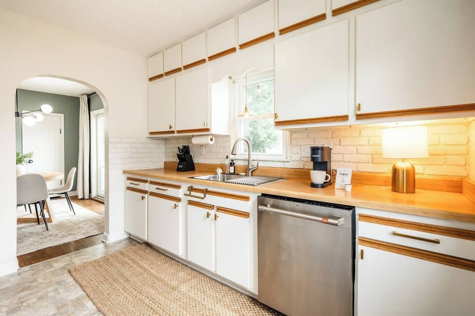 Cook with ease in the bright, fully stocked kitchen, equipped with everything you need for a home-away-from-home experience. The open-concept design flows seamlessly into the dining room, making it perfect for cooking and connecting.