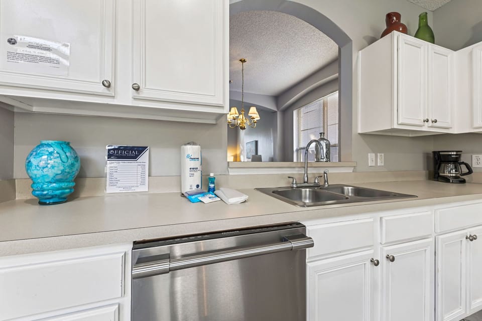 Cook your favorite meals with ease in a sleek kitchen featuring stainless-steel appliances, granite countertops, and all cooking essentials.