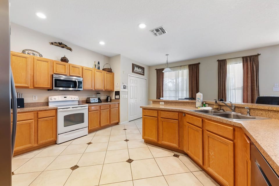 Perfect for cooking and connecting — this open-concept kitchen blends seamlessly with the living and dining areas.
