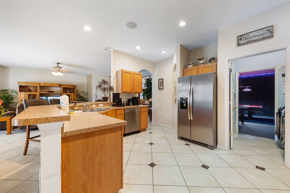 Stay connected with family while preparing meals in this airy space.