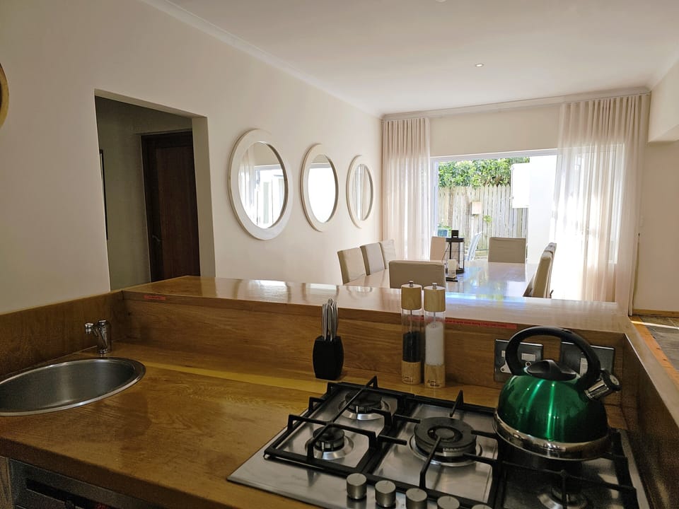 Open plan kitchen, dining flowing onto the side terrace area