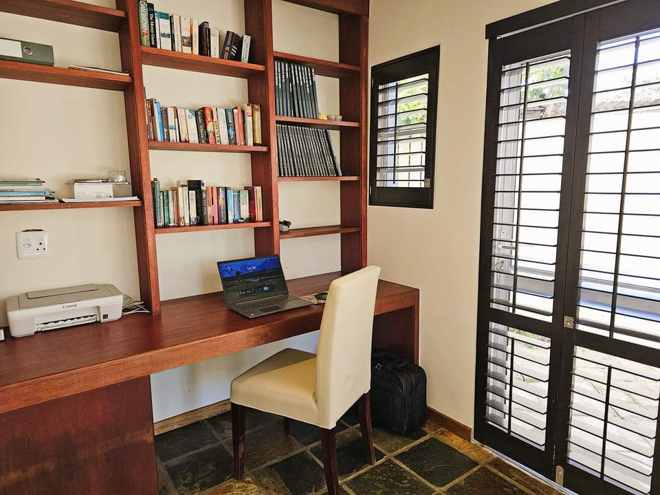 Office desk , adjacent to the TV lounge
