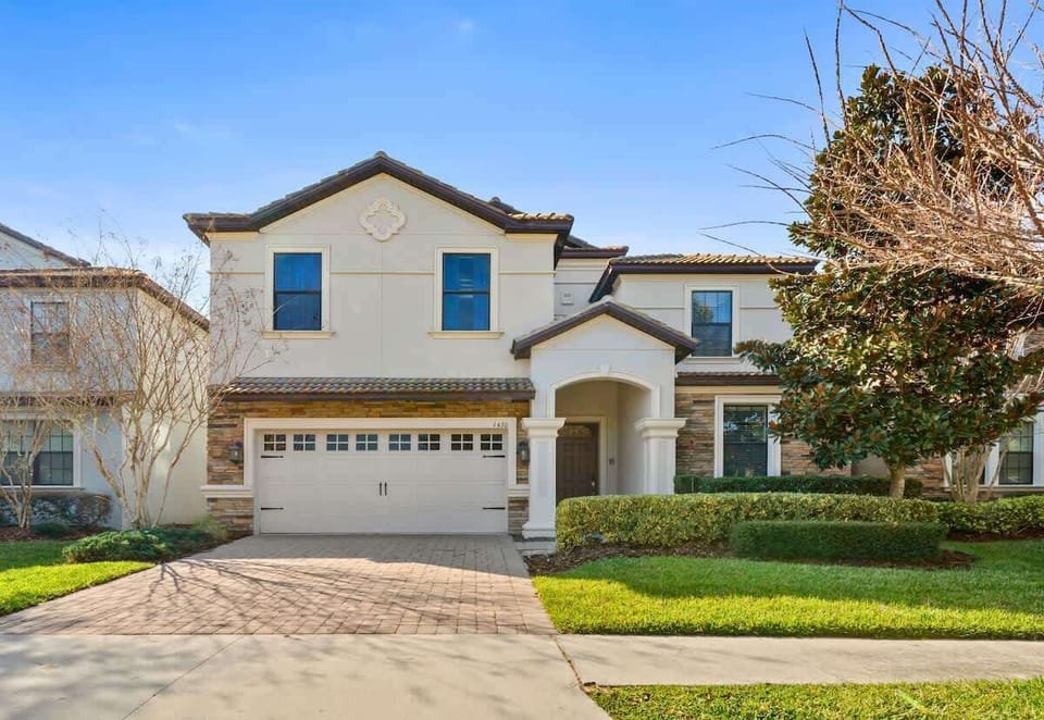 Exterior View: Stunning curb appeal with elegant architecture and lush landscaping awaits you!