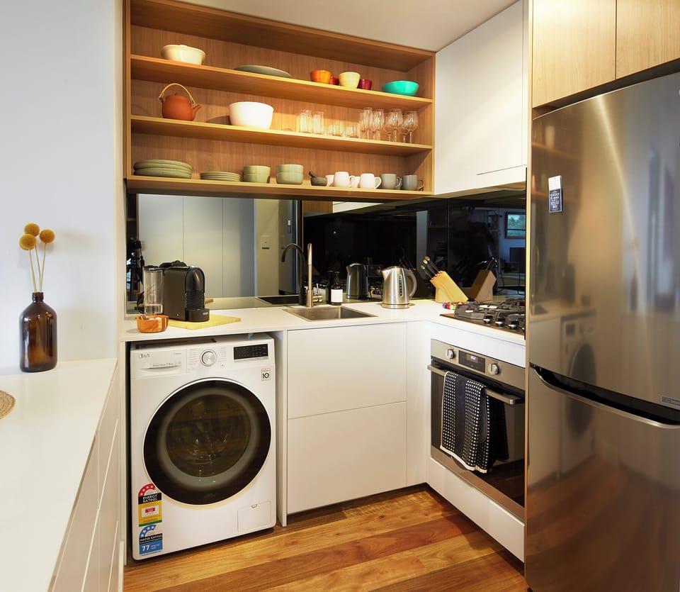 KITCHEN: The modern kitchen has all the needed appliances and a well stocked pantry for cooking pleasure. 