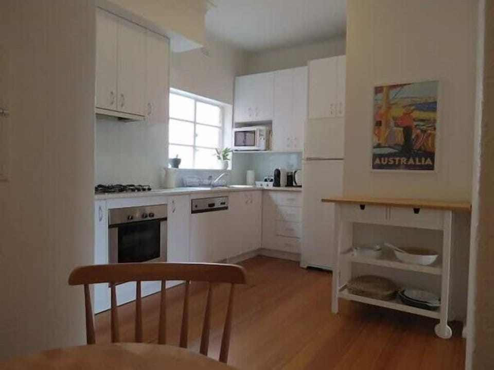 KITCHEN. The bright kitchen has all the modern appliances and is stocked with a  pantry for easy cooking with pleasure.