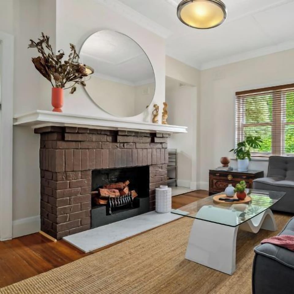 LOUNGE: The  separate Lounge Room with sunny outlook has a large L shaped couch that can sleep a guest for extra accommodation if needed. Linen provided. The lounge has reverse cycle air conditioning.  The fireplace is decorative only. 