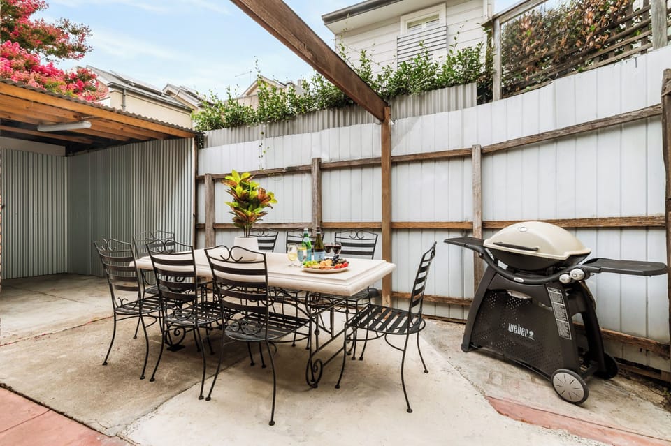 COURTYARD: This property has a private courtyard with outdoor table setting and barbecue. it is perfect for al fresco dining and entertaining. 