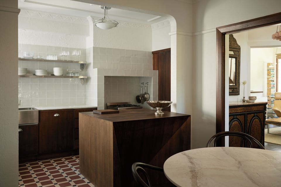 ART DECO HERITAGE: The fully renovated kitchen pays homage to the apartment's Art Deco heritage. 