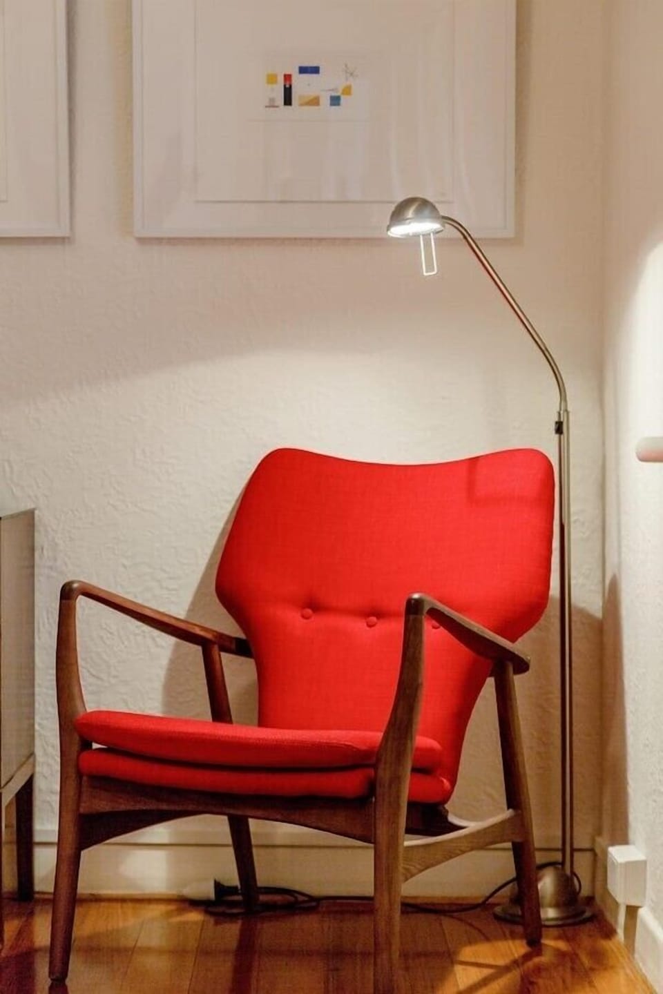 ORIGINAL FURNITURE: The bedroom features original artwork and stylish collected furniture. 