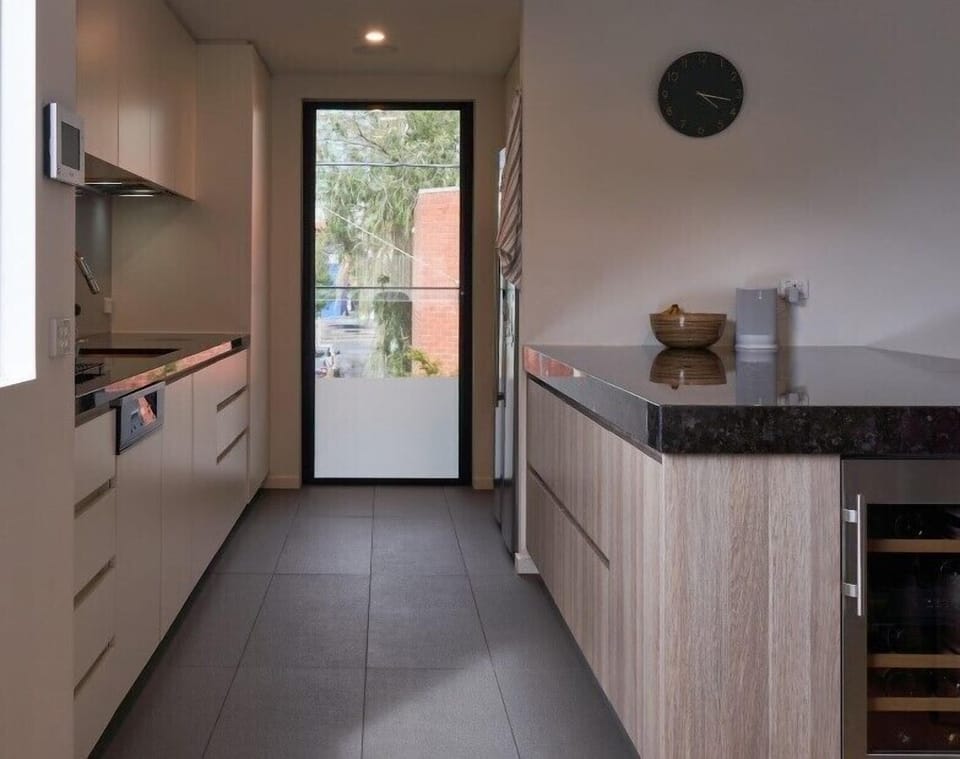 WALK IN PANTRY. The large walk-in-pantry is stocked with some basic cooking ingredients for the cooks convenience. Large preparation bench. Wine fridge. 