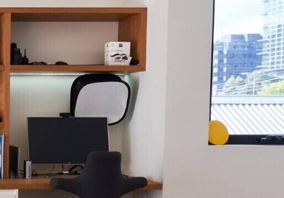 WORKSTATION: The Living Room has a workstation desk with cityscape outlook.