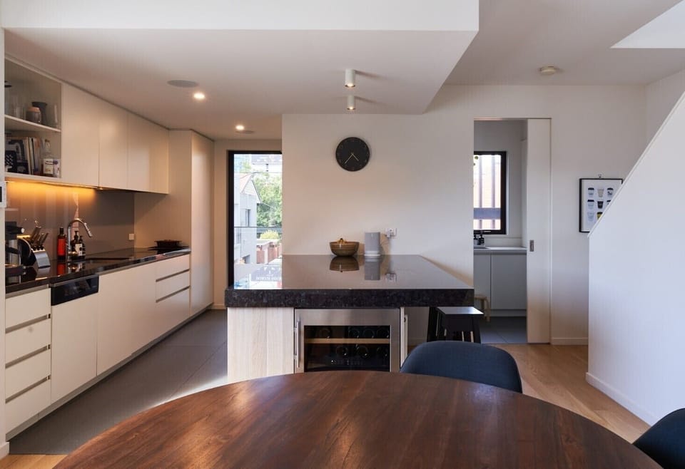 MEALS: The large round table with city view outlook comfortably seat six. Extra chairs available. Large preparation bench with stools. A useful wine fridge is at hand. 