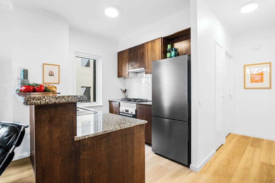 KITCHEN: The kitchen with stone benchtops has everything needed for the serious cook. Appliances include a gas cooktop, electric oven, microwave, dishwasher and Nespresso coffee machine.  The pantry has basic essentials for cooking convenience. 