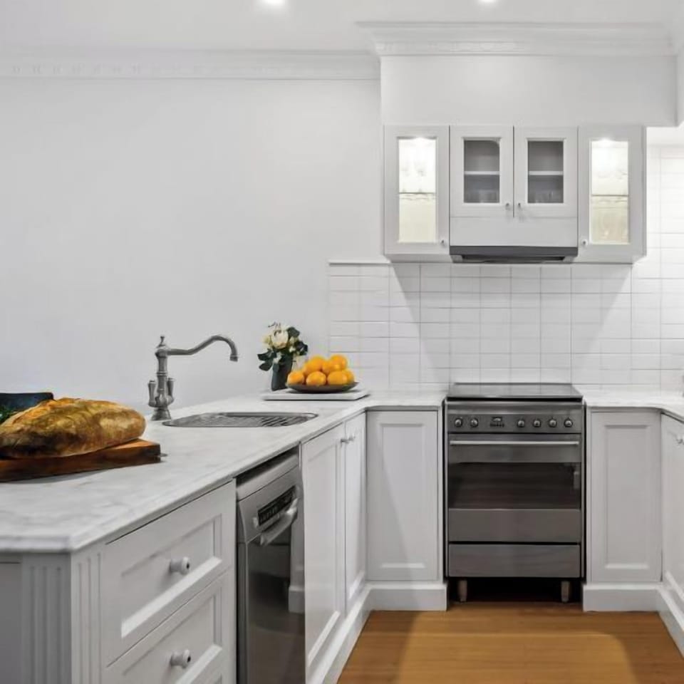 KITCHEN: The stylish modern kitchen is equipped with quality European appliances for cooking pleasure for the serious chef. The pantry is supplied with some cooking basics for the chefs convenience.