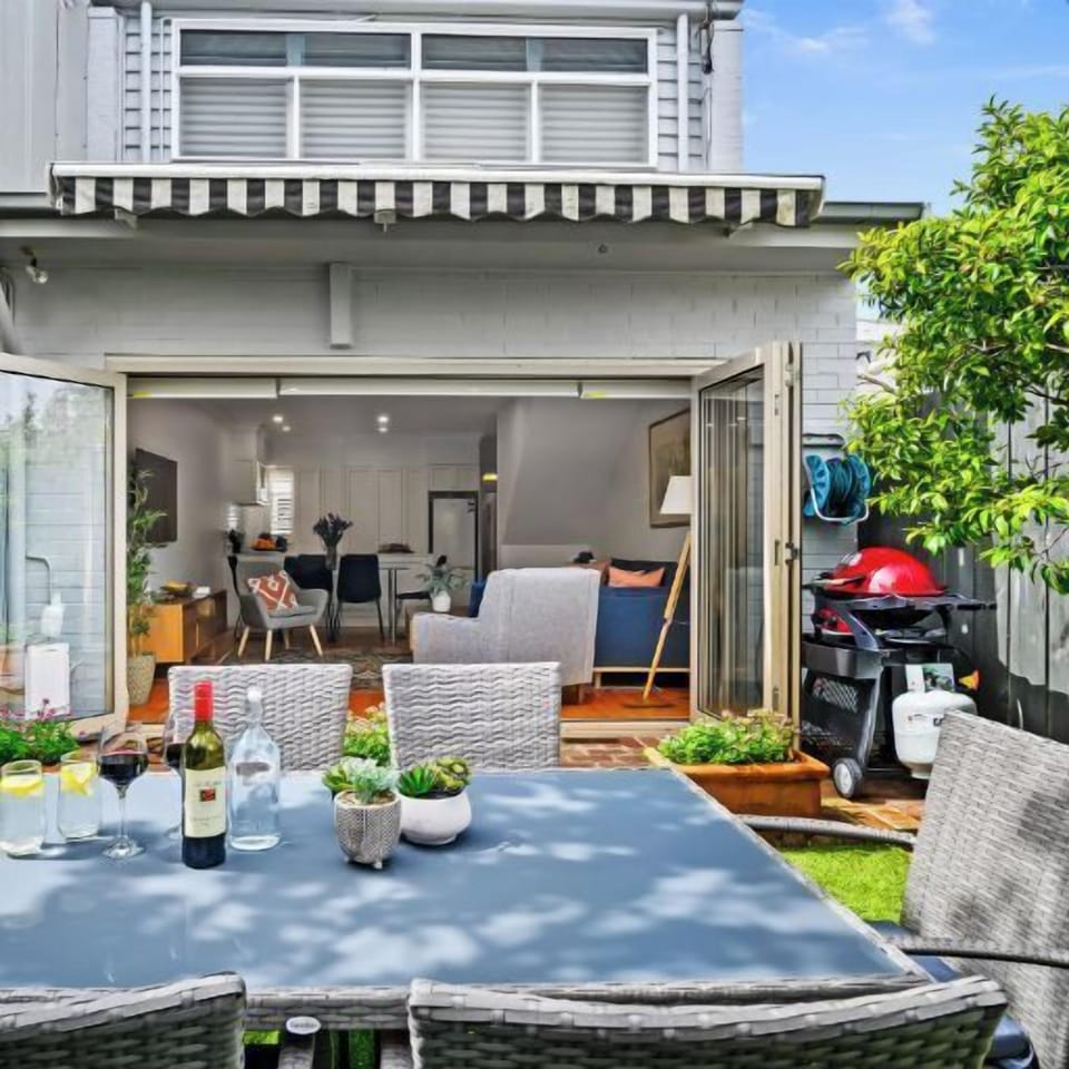 REAR COURTYARD GARDEN: The sunny rear garden, with outdoor setting and barbeque is perfect for al fresco dining and entertaining.