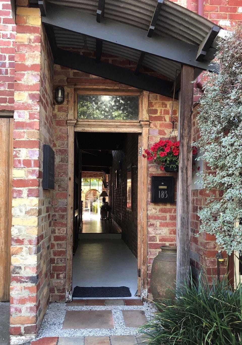 FRONT ENTRANCE: Enter this large, spacious home with its recycled bricks and timber makes for a welcoming homely feel.