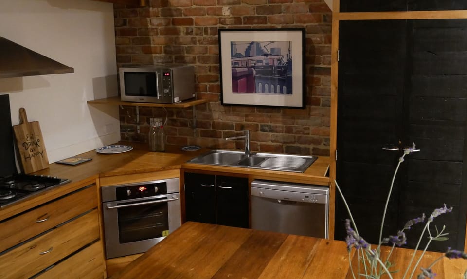 KITCHEN: The fully equipped kitchen has a well stocked pantry for cooking pleasure. The large island bench is perfect for food preparation or serving.