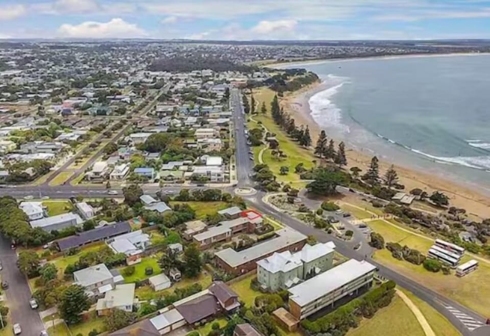 TORQUAY BEACH AND TOWNSHIP. The apartment is located in "Old Torquay" directly opposite the Torquay's sheltered back beach that is famous for it's Norfolk Pine trees. The apartment is marked with the red square. 