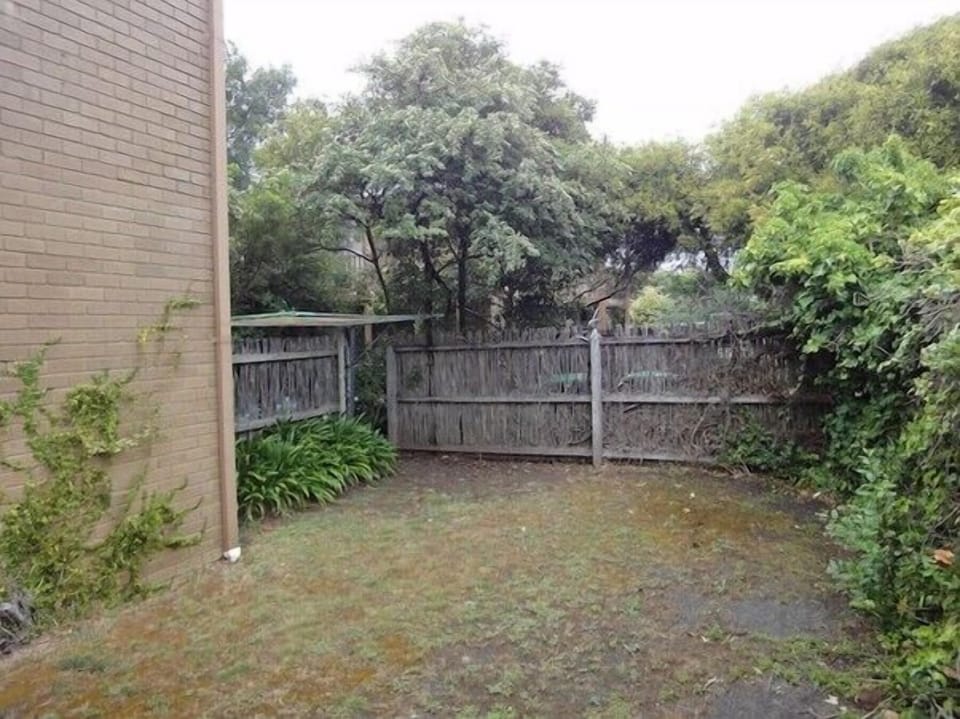 PRIVATE COURTYARD. The private courtyard with gate and is perfect for sun bathing, storing beach equipment or for pets to run around.