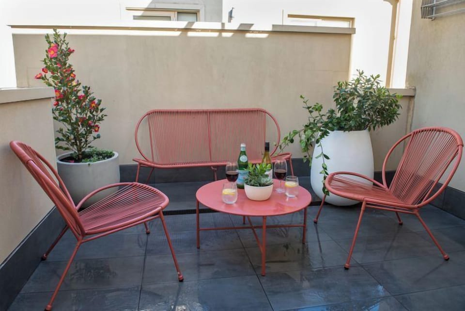 BALCONY: The apartment has two balconies. This balcony on the second level has an outdoor setting that is ideal for al fresco entertaining. 