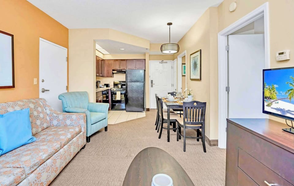Open Living Space With Comfortable Seating And Dining Area