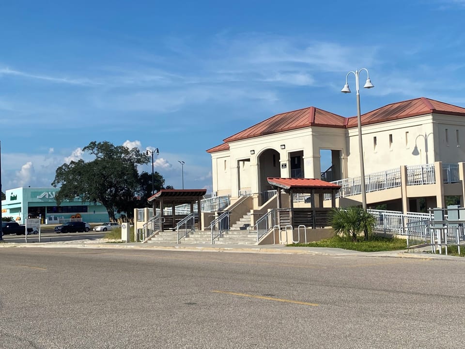Courthouse road rest stop and city transit pickup. Within Walking distance.