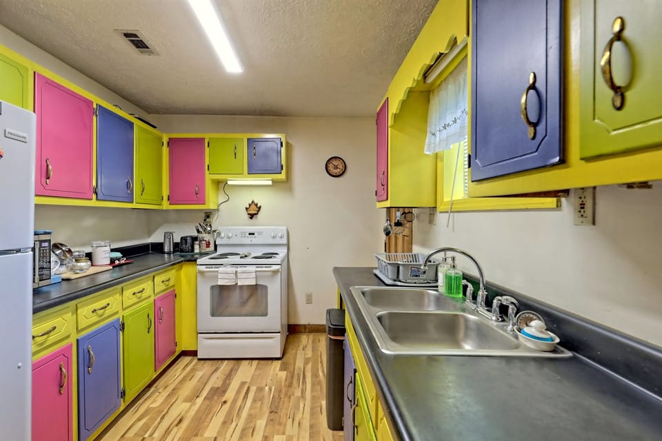 This vibrant kitchen, with long counter is perfect for family cooking sessions.