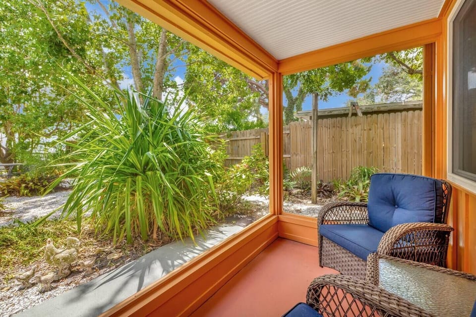 Screened porch area in from of the home