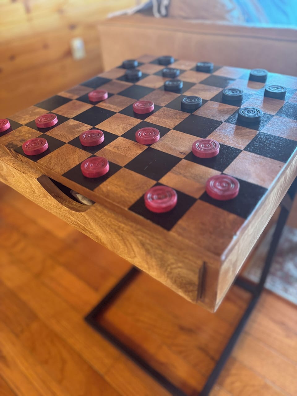 Slow down and play a round-classic wooden checkers by the fire