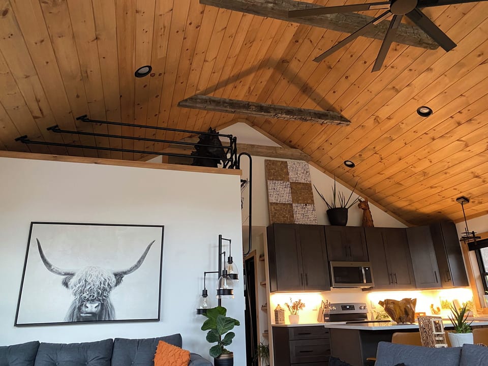 Family Room Looking at Kitchen and Loft.   the beams are over 200 years old
