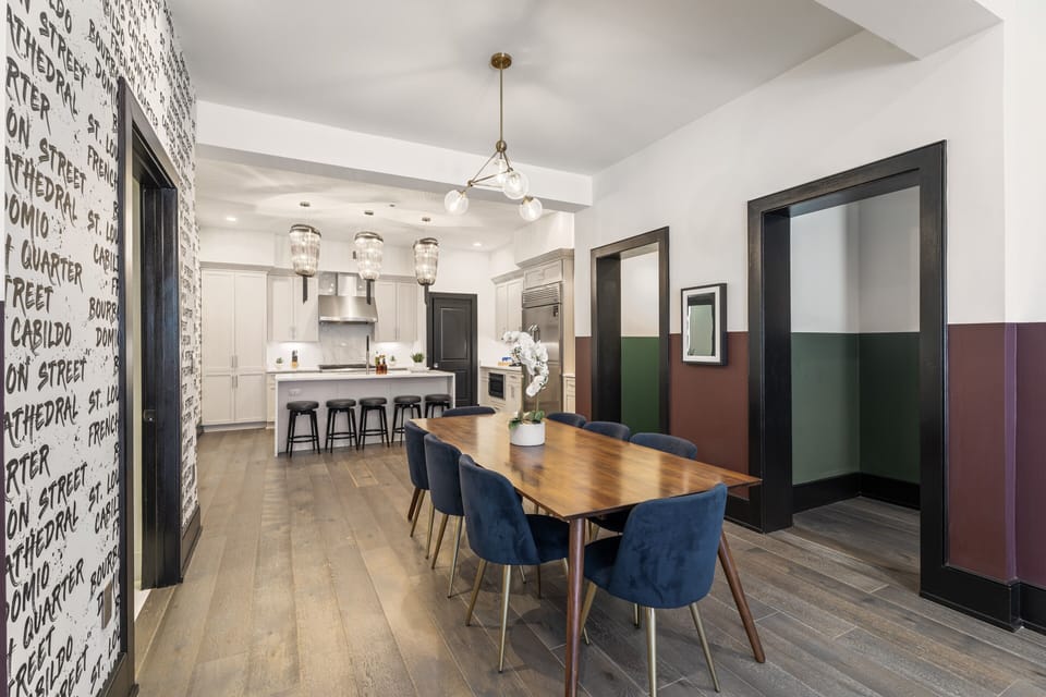 Enjoy meals together at your in-suite dining table with seating for your group. Whether it's takeout, delivery, or a home-cooked meal, this cozy dining area makes every stay at 888 Baronne feel like home in New Orleans.