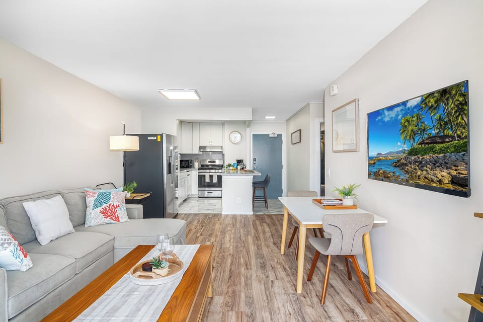 Your living area with pull-out sleeper sofa, and coffee table, and the dining with table and chairs.